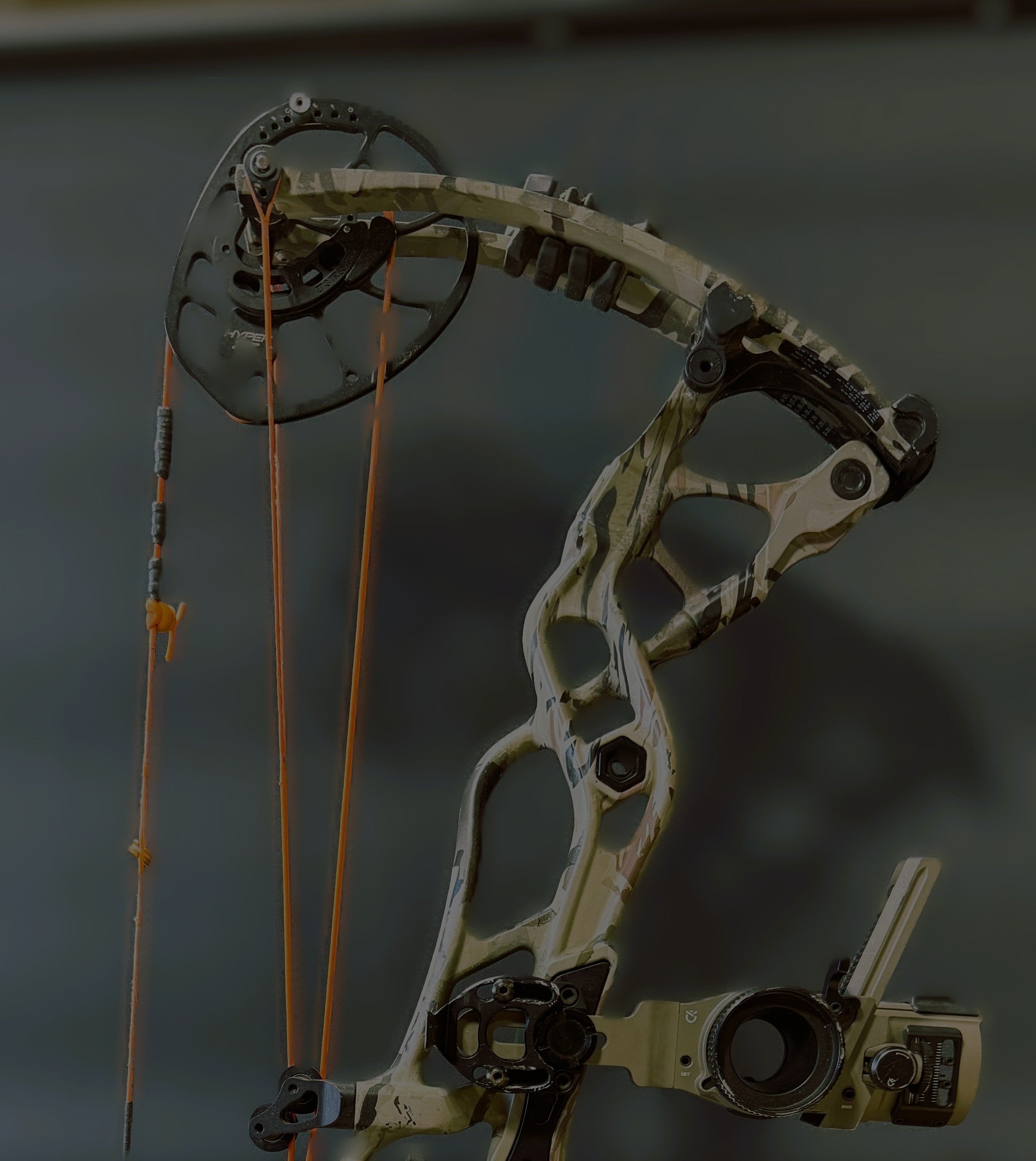 compound bow on a wooden workbench